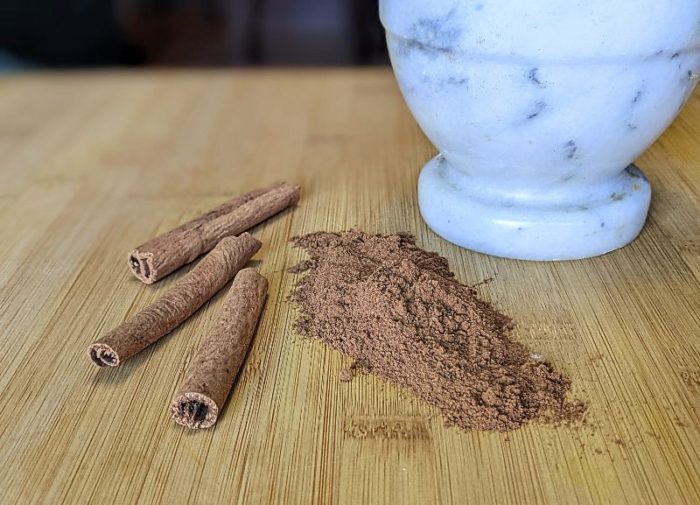 ground cinnamon and cinnamon sticks